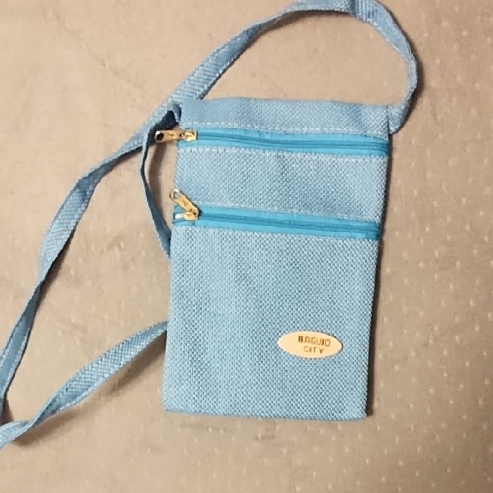 *Pastel Blue Crossbody Bag with Adjustable Strap and Zippered Compartments